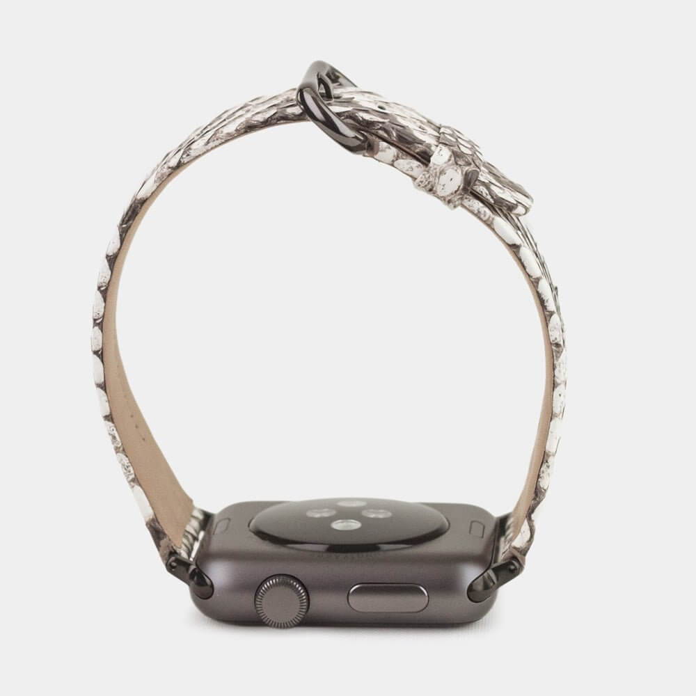 Strap for the Apple Watch 41/42 mm in natural python leather, with black adapters and buckle | watch case on bottom to see leather texture, inner lining and the buckle