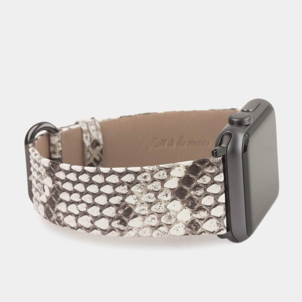 Strap for the Apple Watch 41/42 mm in natural python leather, with black adapters and buckle | close-up on the inner lining leather and the brand stamp