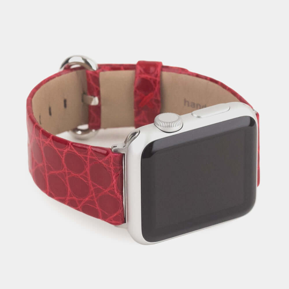 Strap for the Apple Watch 45/46 mm in red shiny alligator leather, with steel adapters and buckle | 3/4 profile view to see the inner lining leather