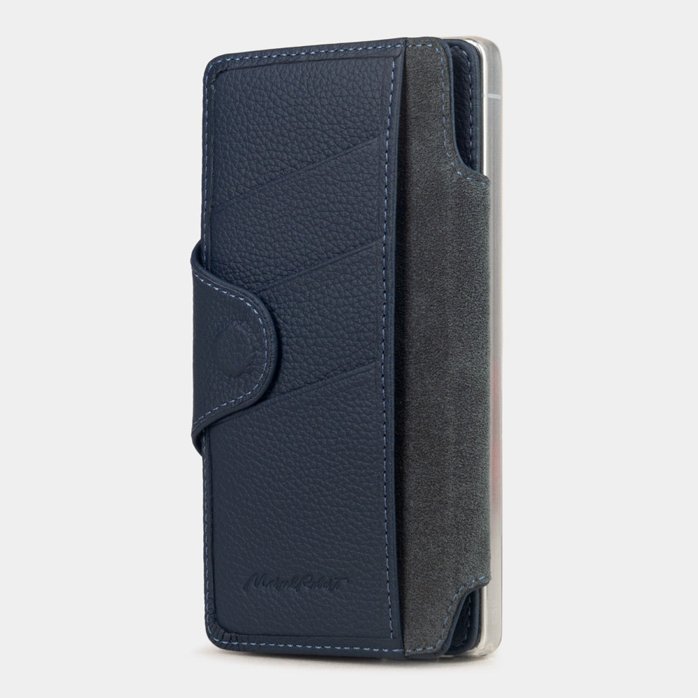 blue leather Samsung S26 Ultra flip case with magnetic closure, cover folded to the back of the smartphone revealing the interior