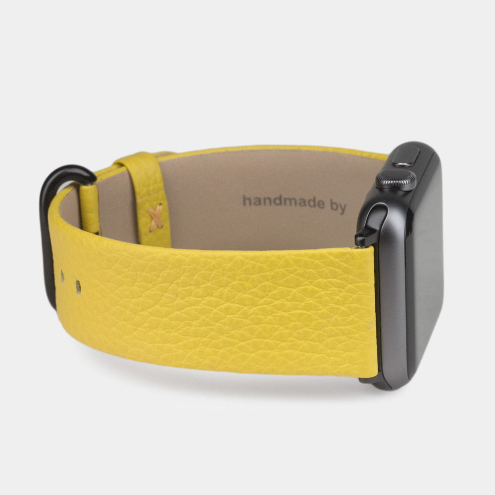 Strap for the Apple Watch 41/42 mm in yellow soft grained calfskin leather, with black adapters and buckle | 3/4 profile view to see the inner lining leather