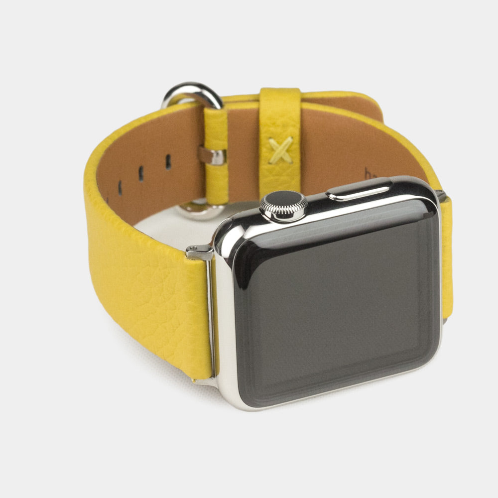 Strap for the Apple Watch 41/42 mm in yellow soft grained calfskin leather, with steel adapters and buckle | 3/4 profile view to see the inner lining leather