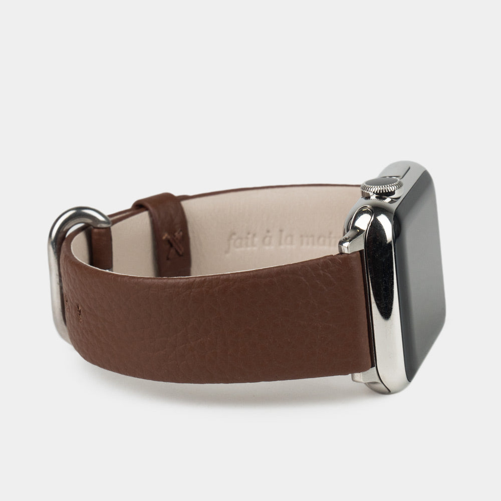 Strap for the Apple Watch 41/42 mm in brown soft grained calfskin leather, with steel adapters and buckle | 3/4 profile view to see the inner lining leather