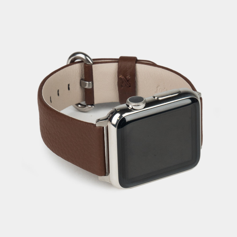 Strap for the Apple Watch 41/42 mm in brown soft grained calfskin leather, with steel adapters and buckle | close-up on the inner lining leather and the brand stamp
