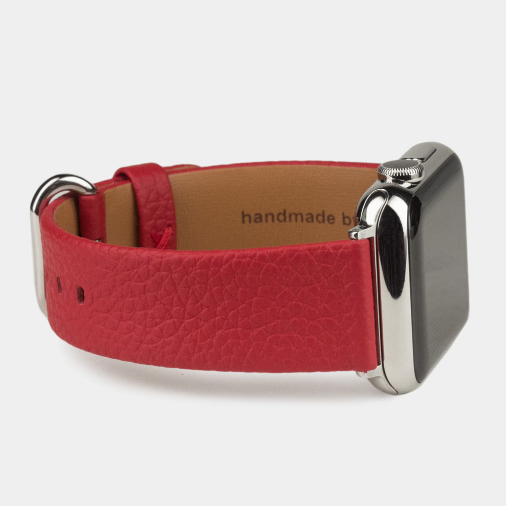 Strap for the Apple Watch 41/42 mm in red soft grained calfskin leather, with steel adapters and buckle | close-up on the inner lining leather and the brand stamp