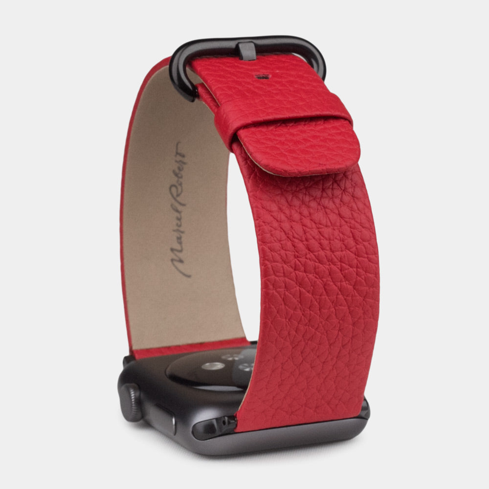 Strap for the Apple Watch 41/42 mm in red soft grained calfskin leather, with black adapters and buckle | front view of the strap looped around the watch case