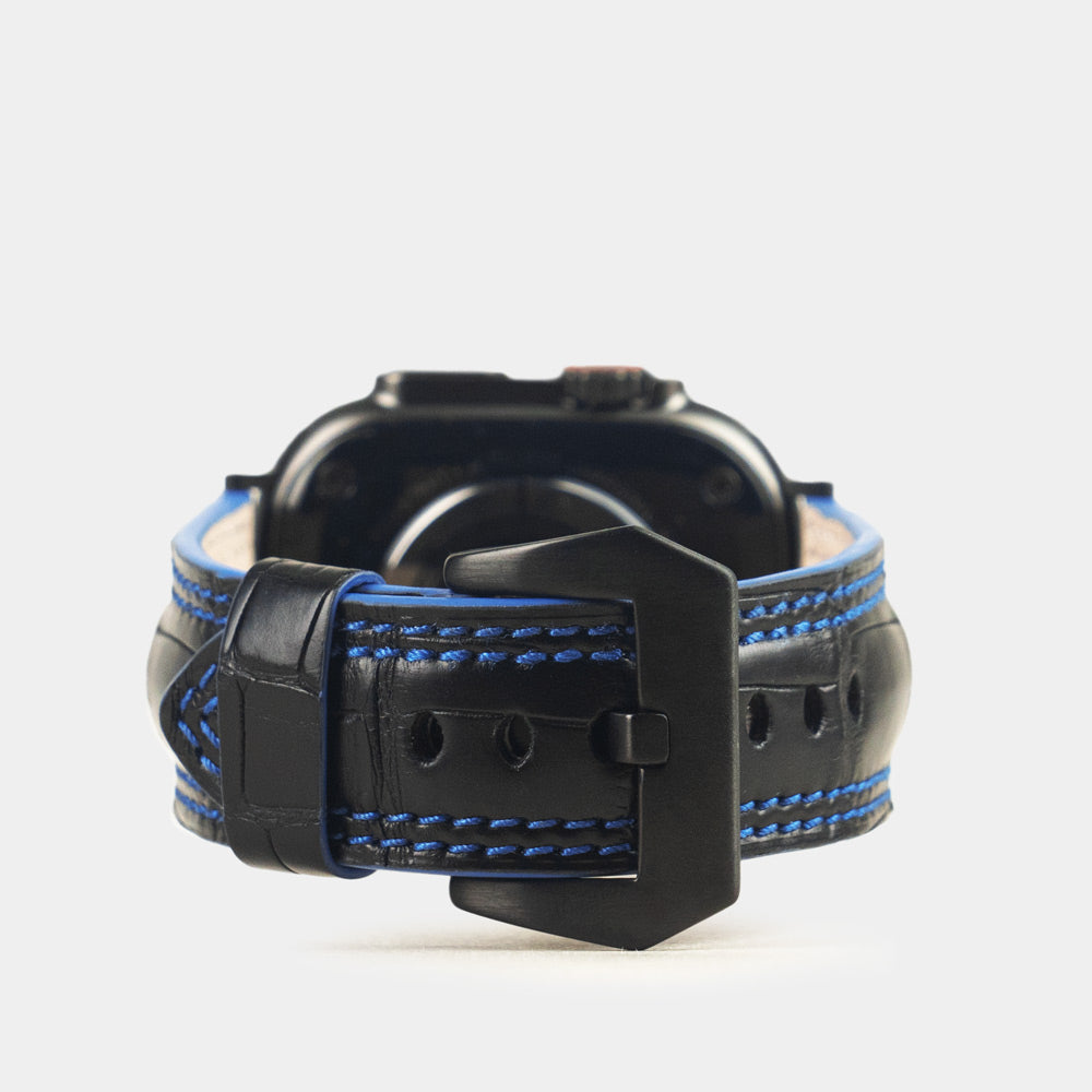 Apple Watch Ultra 49 mm in black alligator leather with blue stitching and edge, with black adapters and buckle | main image