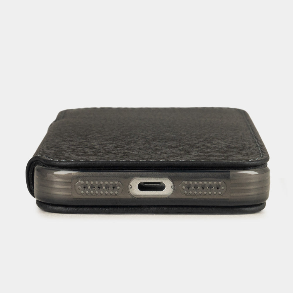 black leather wallet case iPhone 17 - flat side view displaying ultra-thin handcrafted design, USB-C port opening and precise edge finishing