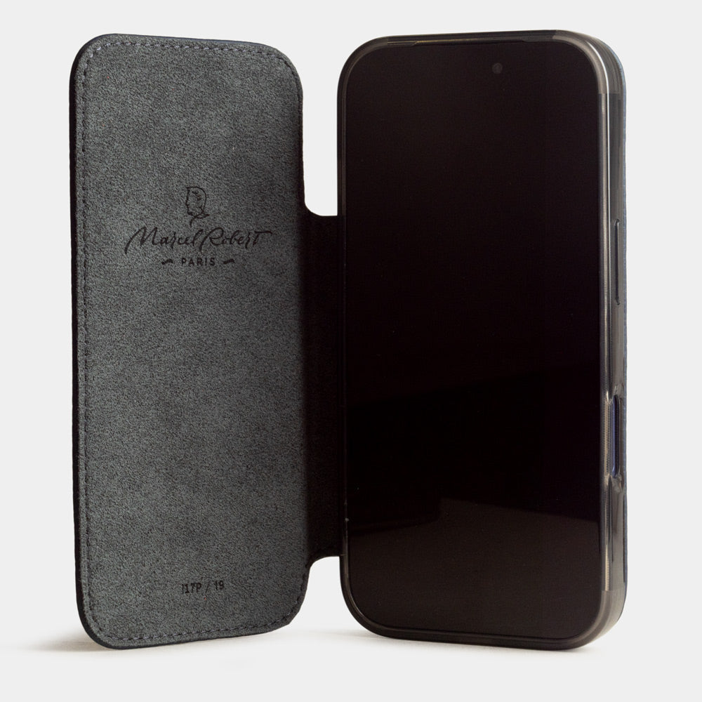 iPhone 17e & 16e calfskin folio wallet case blue – case with grey Alcantara lining, shown open on the smartphone