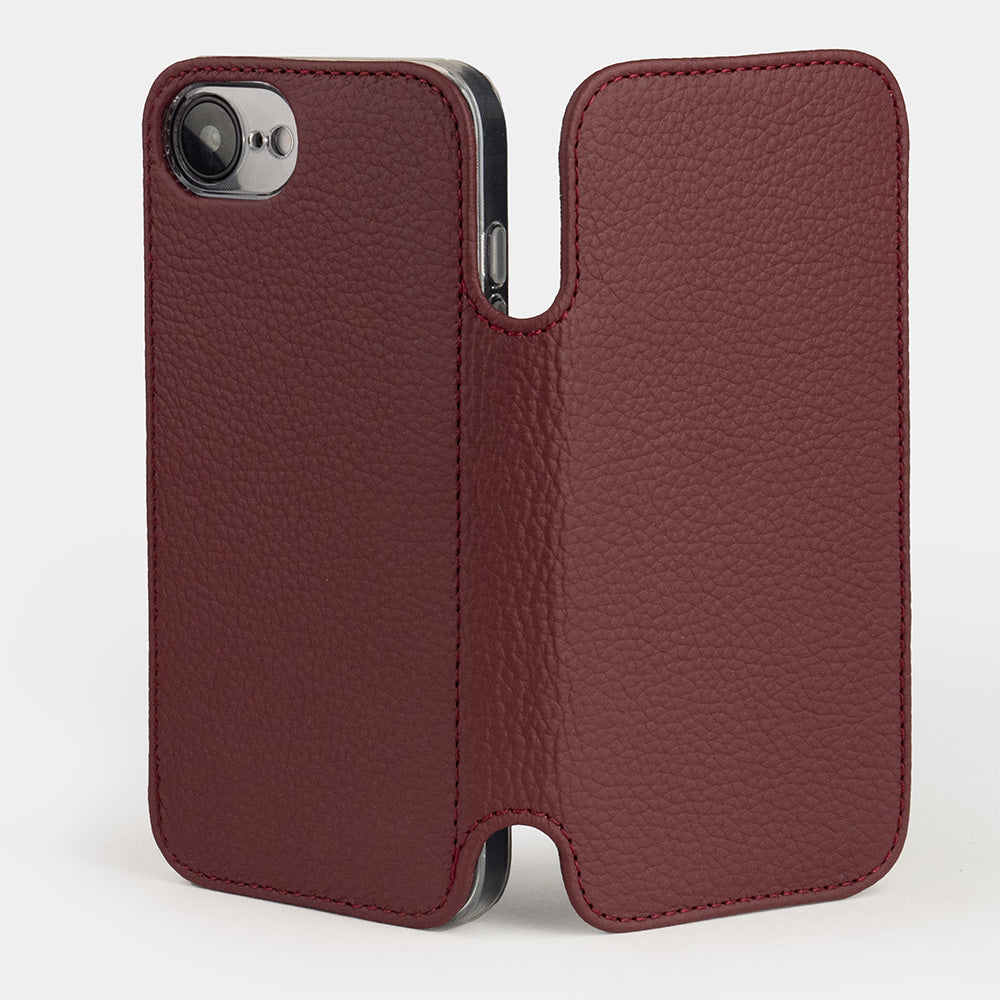 iPhone 17e & 16e calfskin folio wallet case bordeaux – standing open, outside view showing the back with single camera cutout and the unfolded front flap